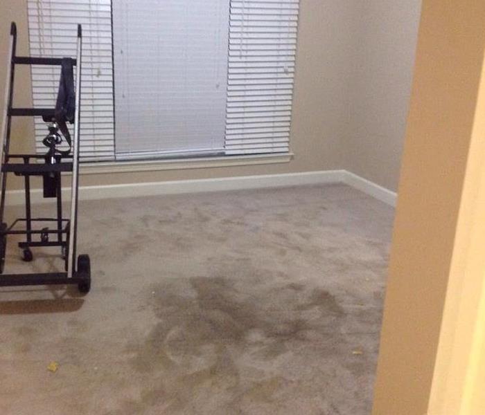 An apartment bedroom with water damage
