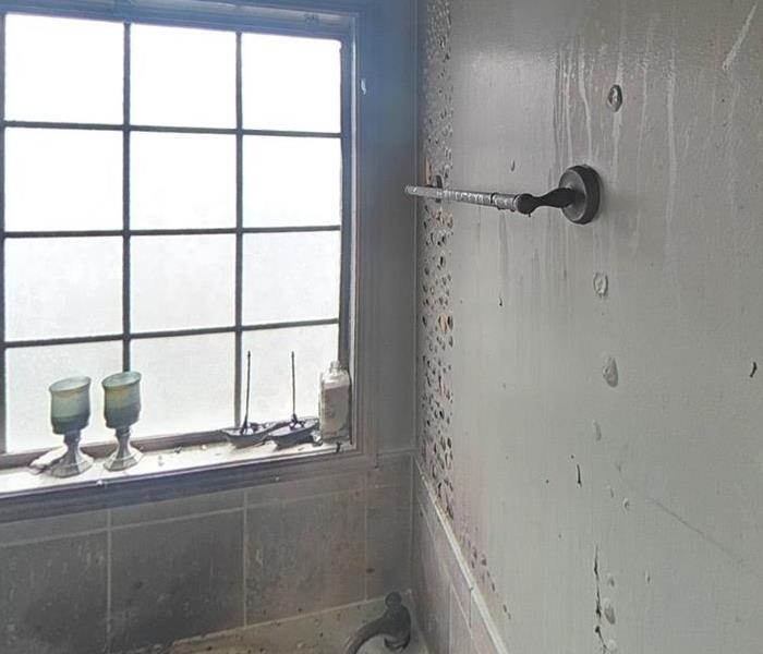 water and smoke damaged bathroom