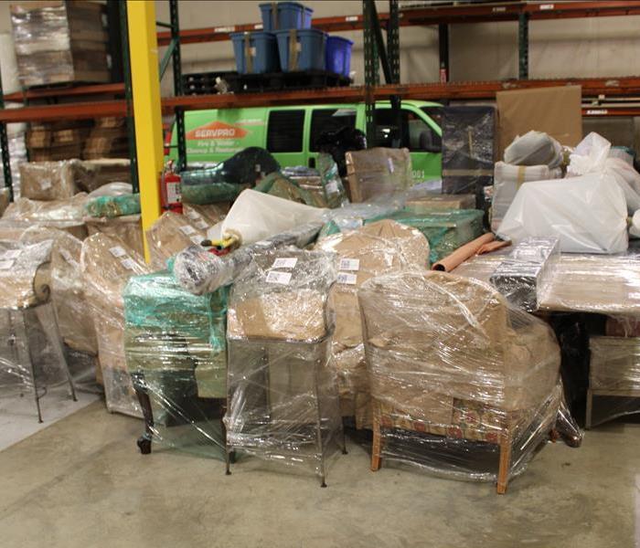 SERVPRO warehouse housing plastic wrapped furniture and other content to be professionally cleaned and stored