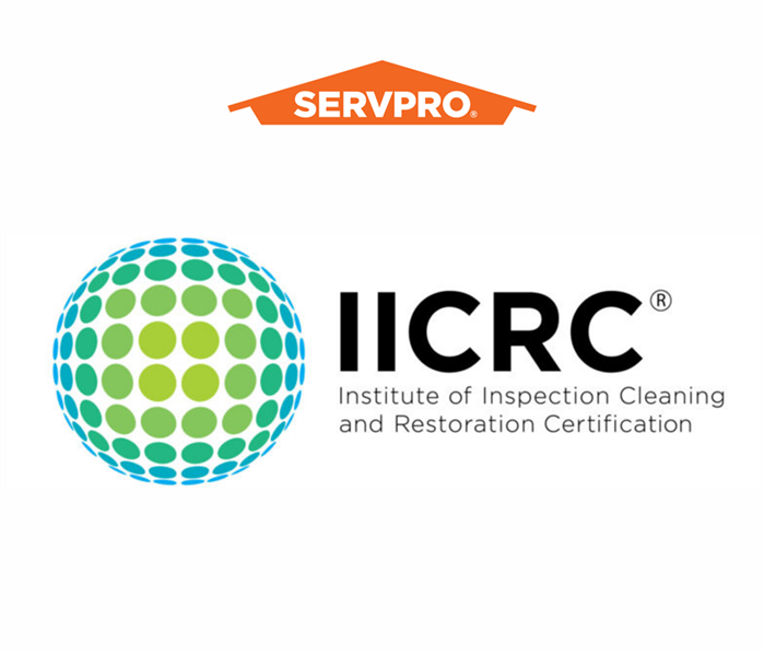 IICRC logo with dotted globe and orange SERVPRO house logo
